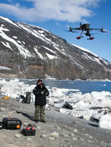 Colin Aitcheson from the Murihiku team deploys a drone at Cape Adare. Photograph Supplied: Dr Regina Eisert.